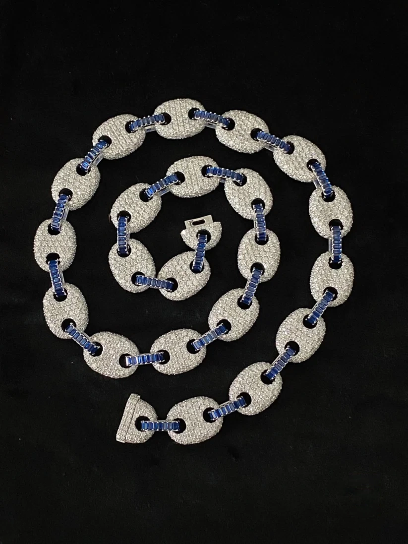 close up of a  Iced out diamond mariner chain with blue sapphires