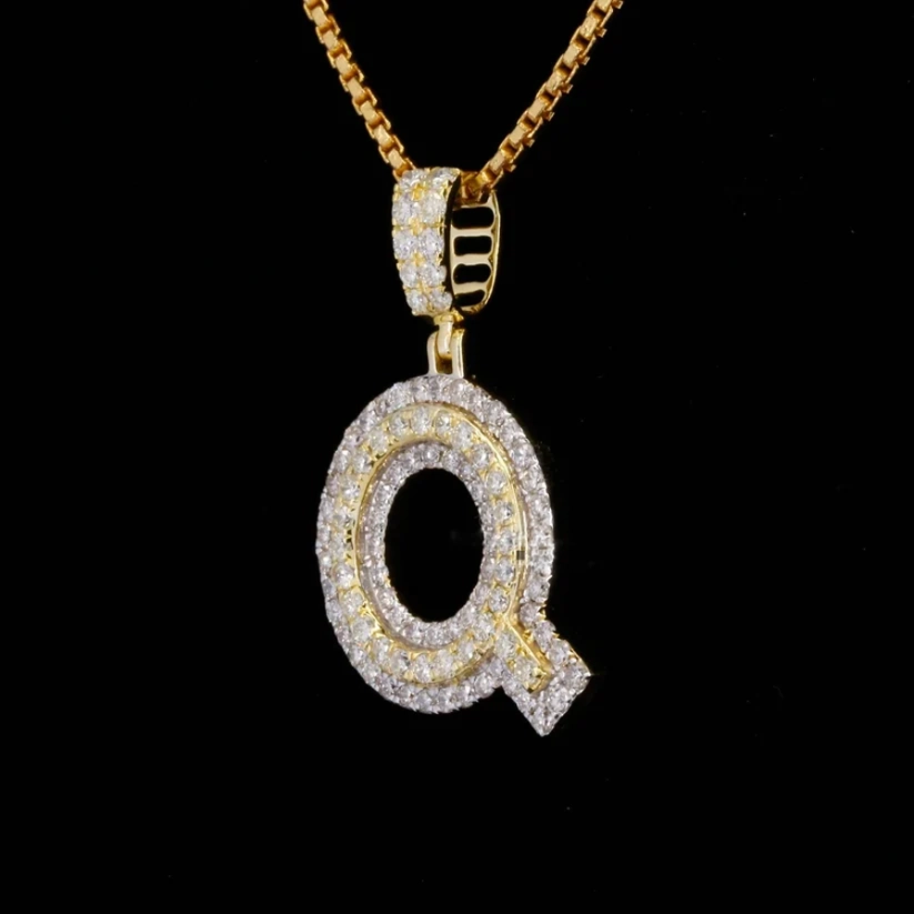 Gold box chain necklace featuring a diamond-encrusted initial "Q" pendant.