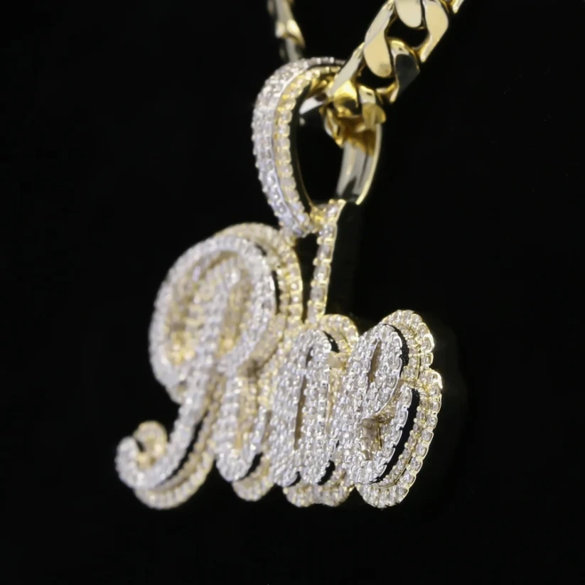 Close-up of a personalized Rae script hip-hop jewelry charm covered in brilliant cut diamond accents.