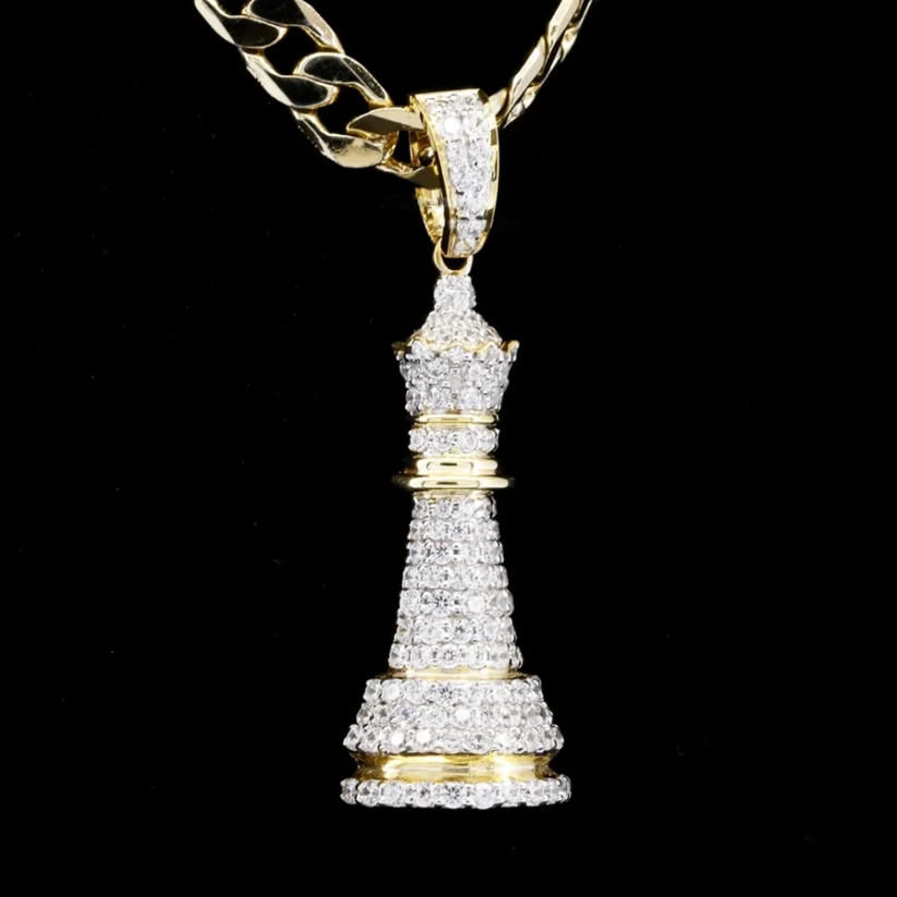 Iced out chess queen pendant in yellow gold with pave diamonds.