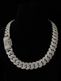 front view of the Silver iced-out Cuban link chain necklace with a diamond-encrusted box clasp