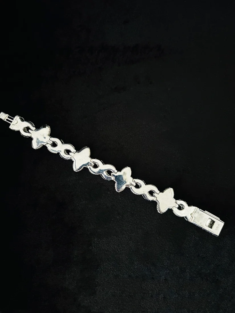 Sterling silver four-leaf clover bracelet with red stones and pave Moissanite diamond 