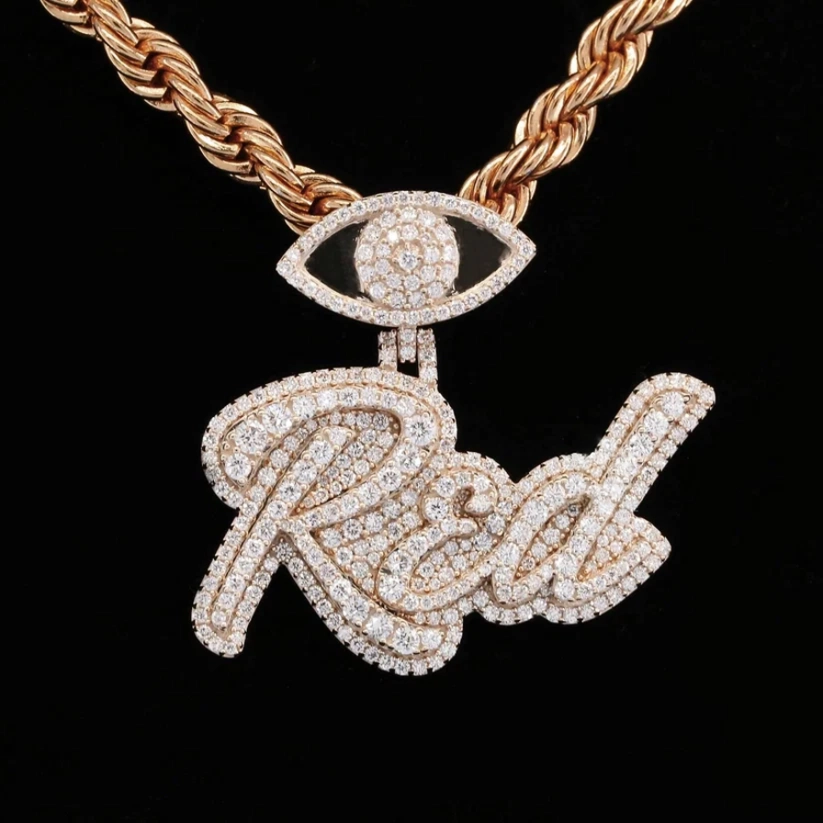 Custom cursive name pendant with diamond evil eye on a rose gold rope chain.