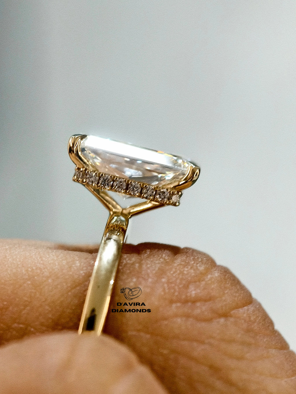 radiant cut diamond ring in gold with a hidden halo basket