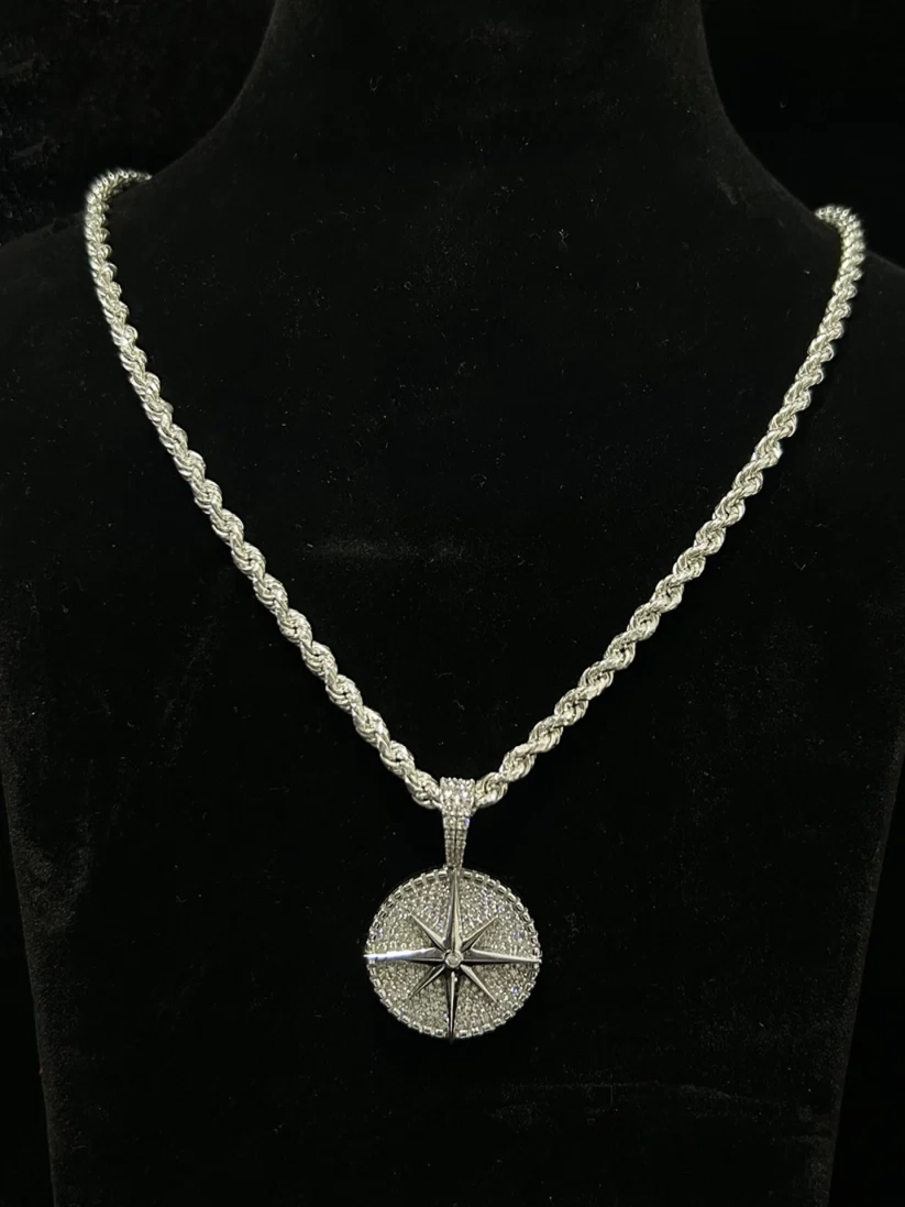 Silver rope chain necklace with an iced-out compass rose pendant
