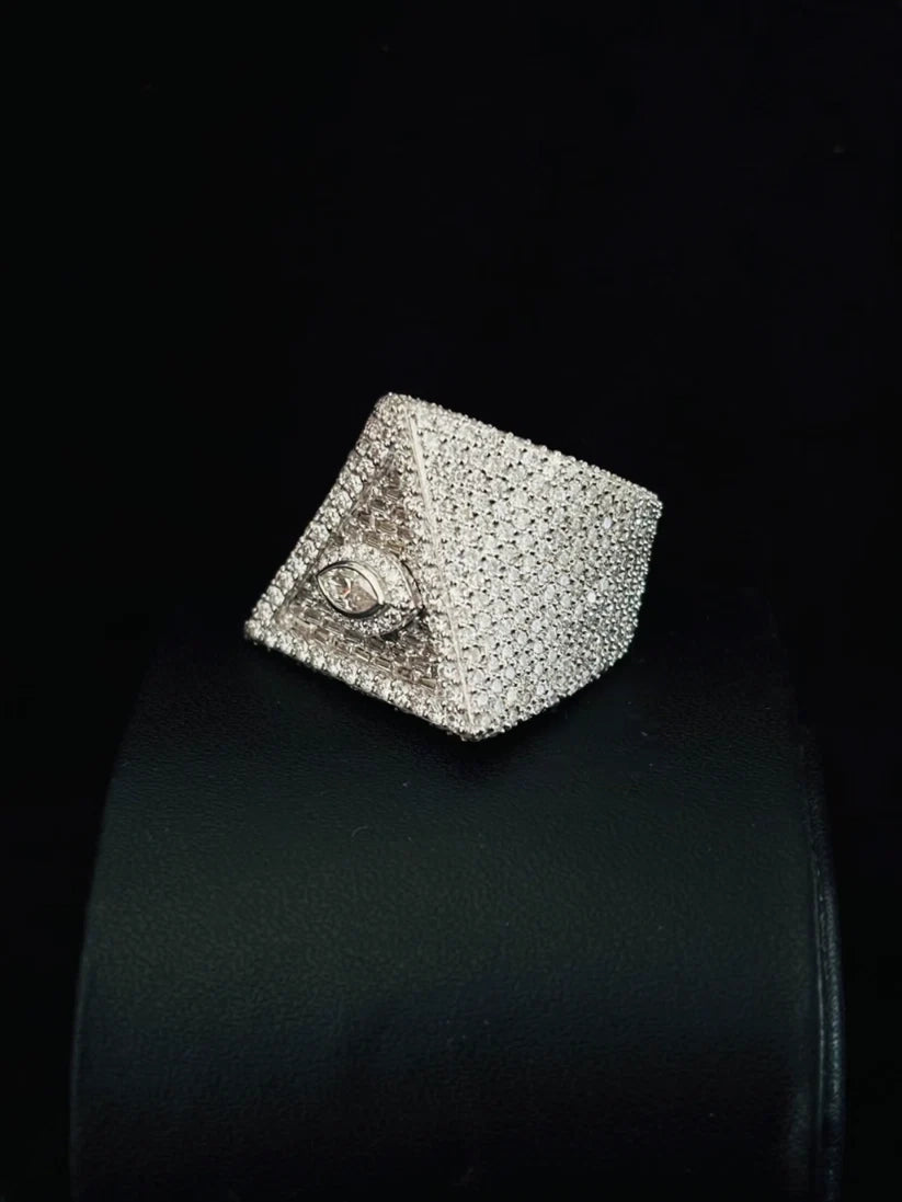 Hip hop style iced-out pyramid pinky ring with a stone-encrusted evil eye symbol