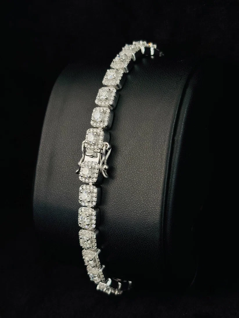 Silver square halo diamond tennis bracelet with a double-latch clasp close-up