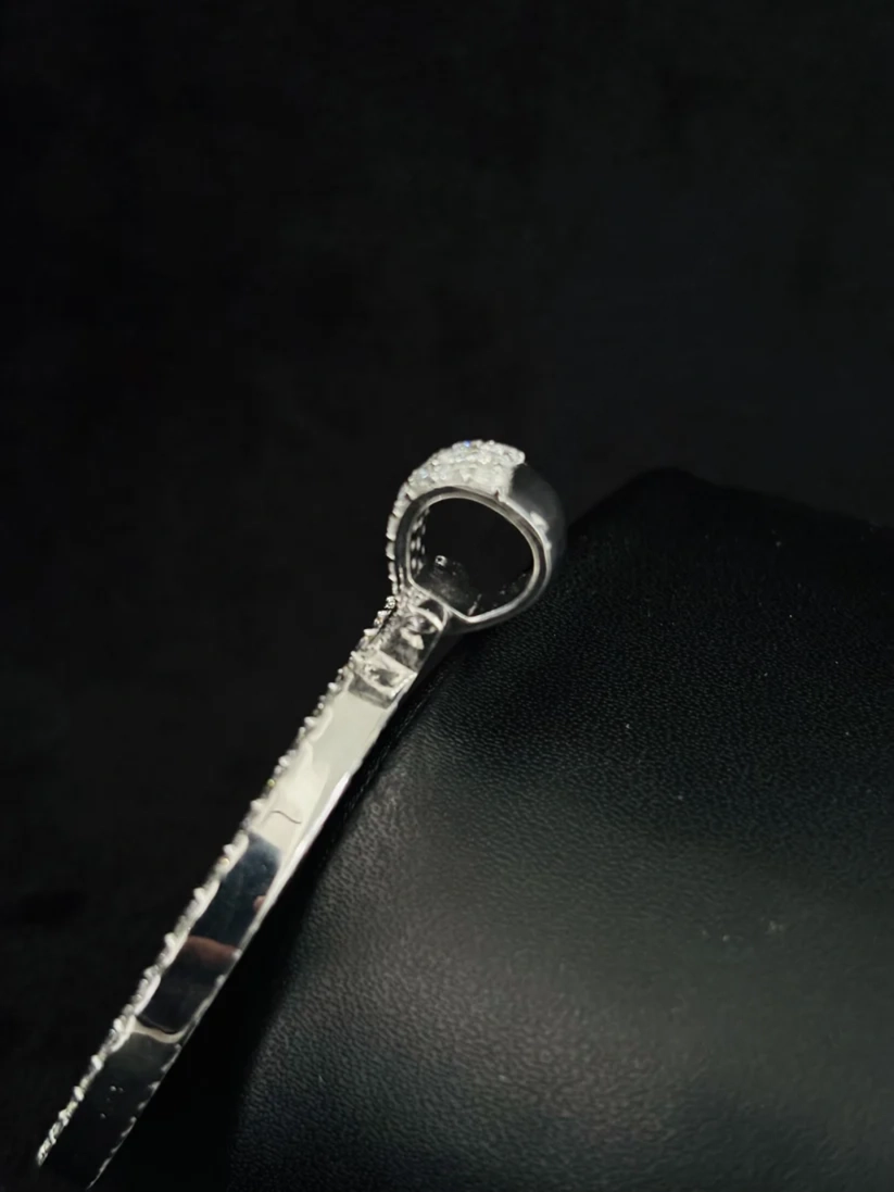 Silver-plated pavé crystal loop bangle bracelet profile view
