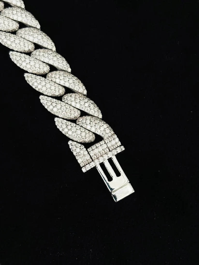 High-polished heavy metal men's curb bracelet shown flat against a dark backdrop