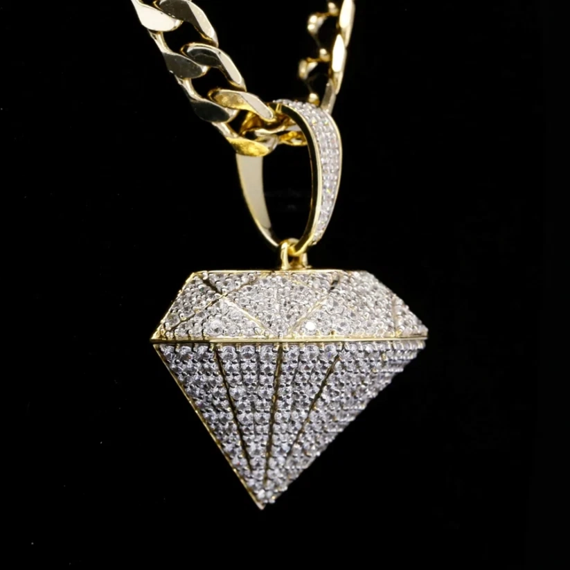 Gold cuban link chain with a large 3D diamond shaped iced out pendant