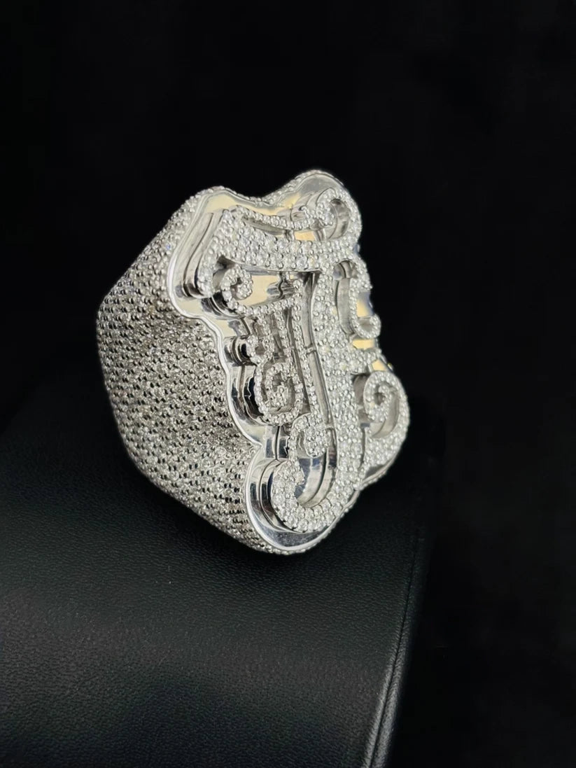 side view Large iced-out custom initial letter J pinky ring in white gold covered in pavé diamonds
