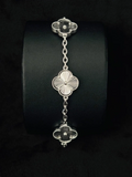 Close-up of a luxury Van Cleef Alhambra bracelet in Silver sunburst engraving
