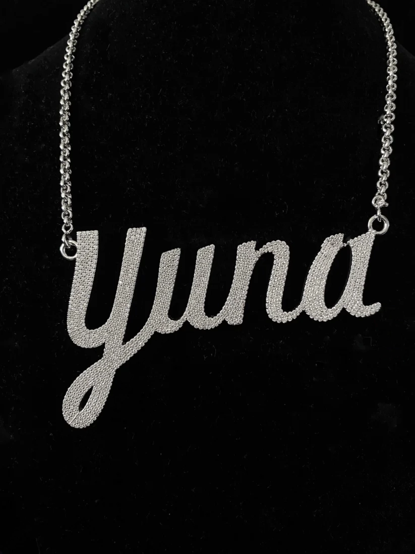 Custom diamond name necklace featuring Yuna in script font