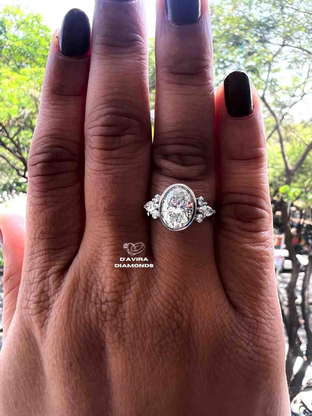 Lab grown oval engagement rings with Bezel Setting Featuring oval Side Stones