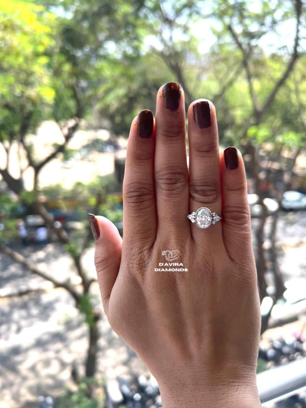 Lab grown oval engagement rings with Bezel Setting Featuring oval Side Stones