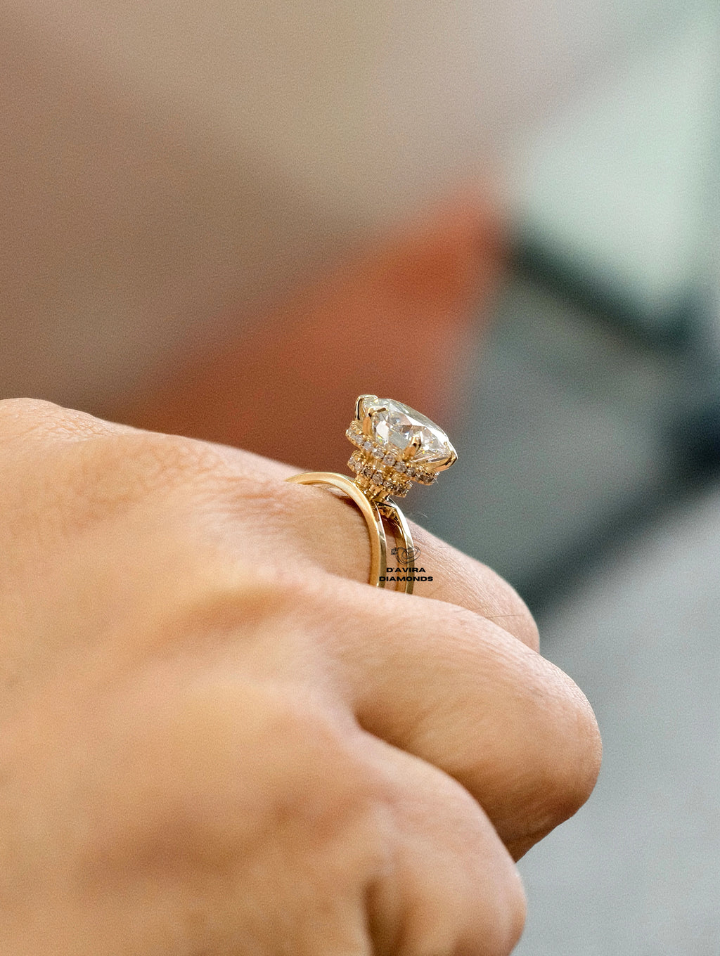 side view high set basket or unique halo setting on a yellow gold band