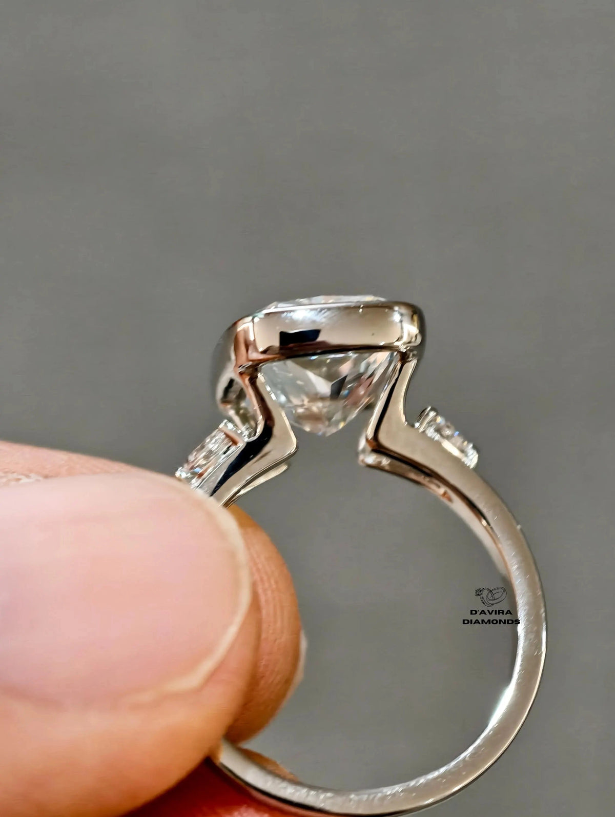 3 stone bezel set cushion cut diamond ring 