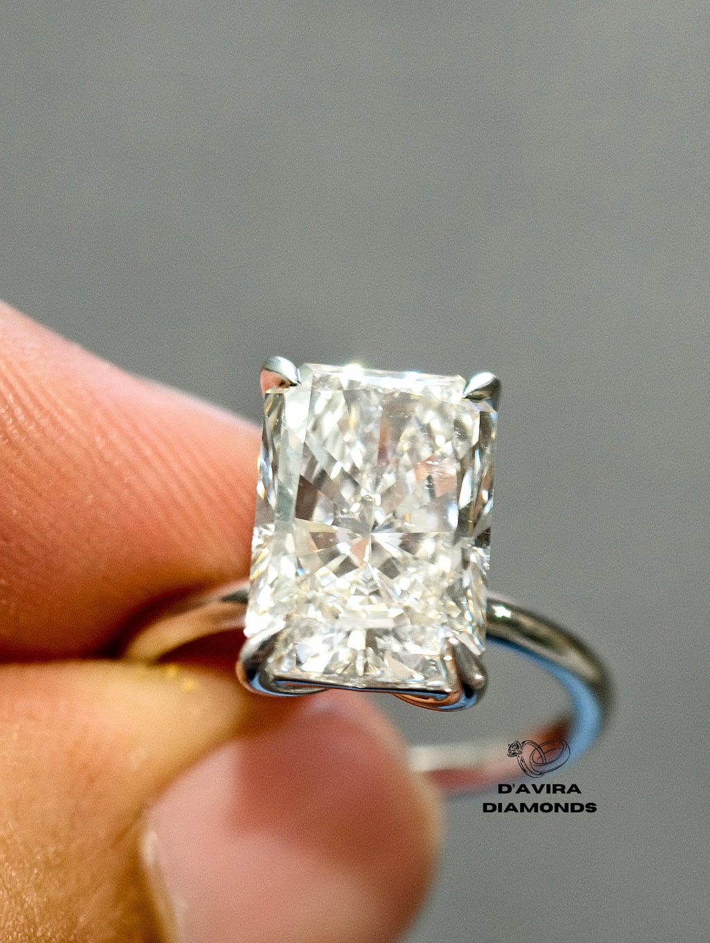 Close-up of a diamond engagement ring with a tulip basket setting