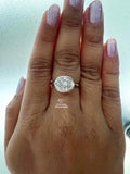 East West Oval Cut Half Bezel Set Diamond Ring
