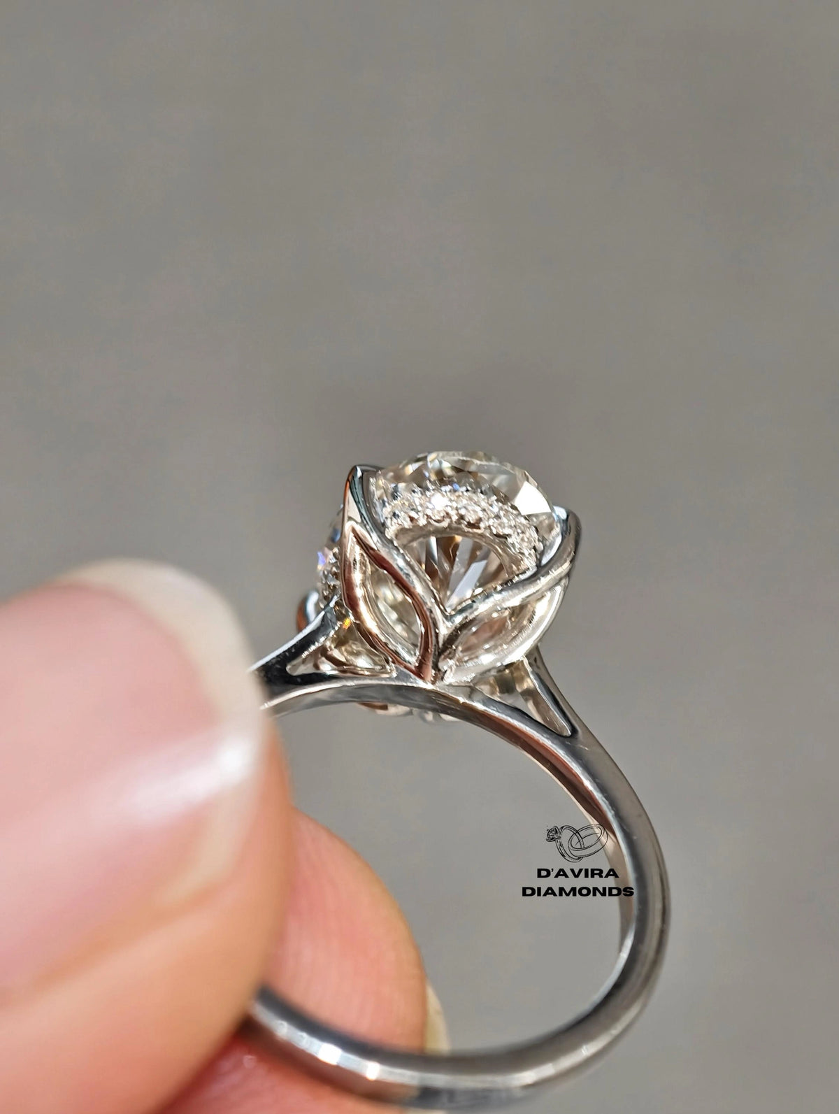 back view of the oval cut diamond engagement ring with a white gold tulip petal setting