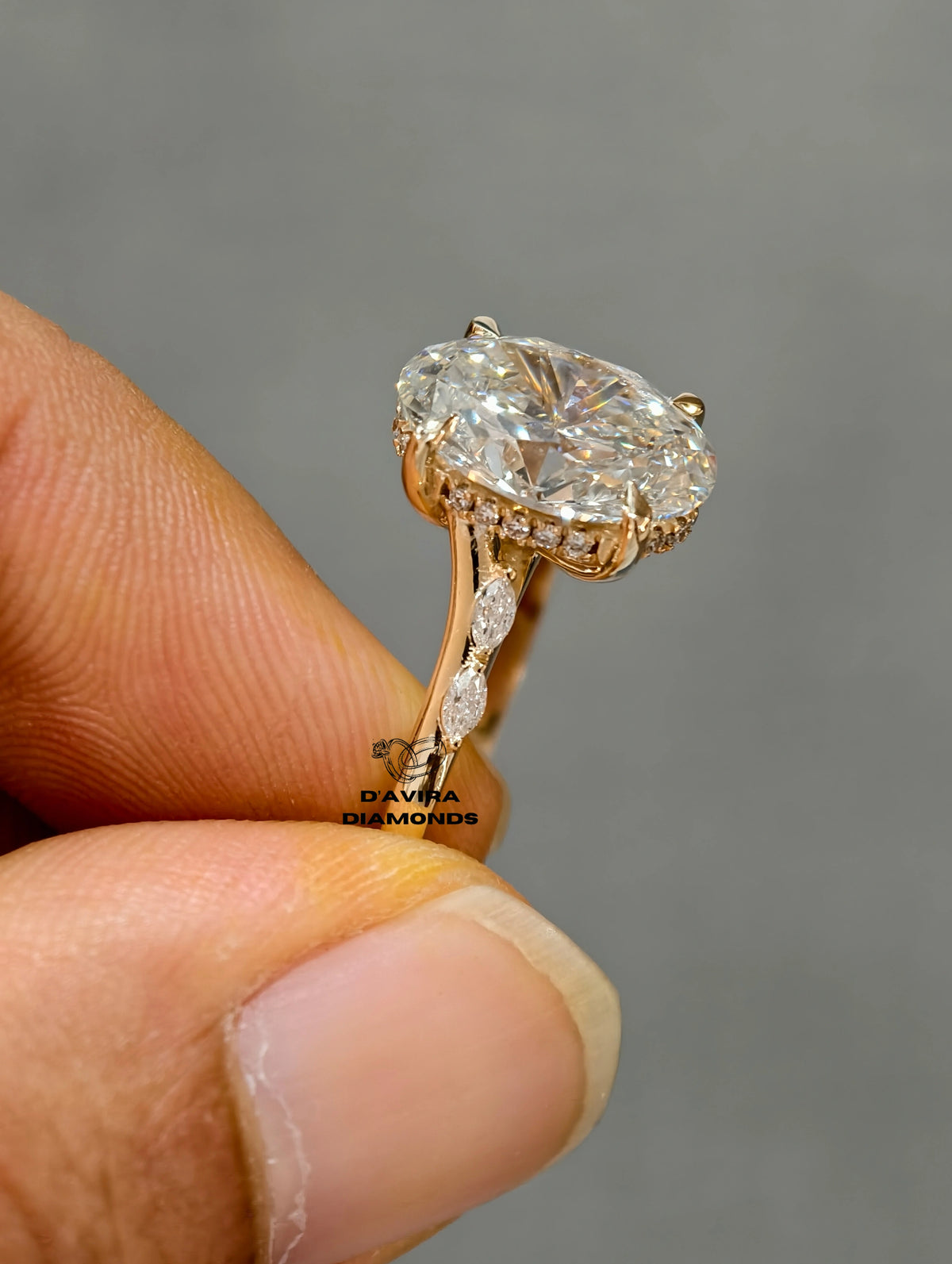 side view gold hidden halo setting and a diamond band