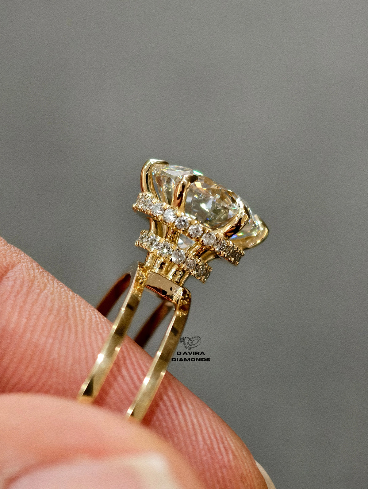 side view round center stone with a multi-layered halo set and a split shank