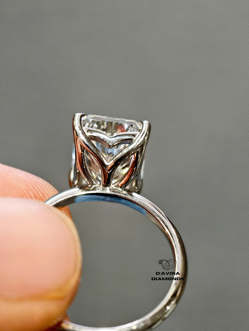 radiant cut diamond solitaire engagement ring in a four-prong setting