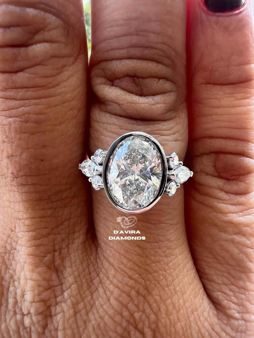 Lab grown oval engagement rings with Bezel Setting Featuring oval Side Stones