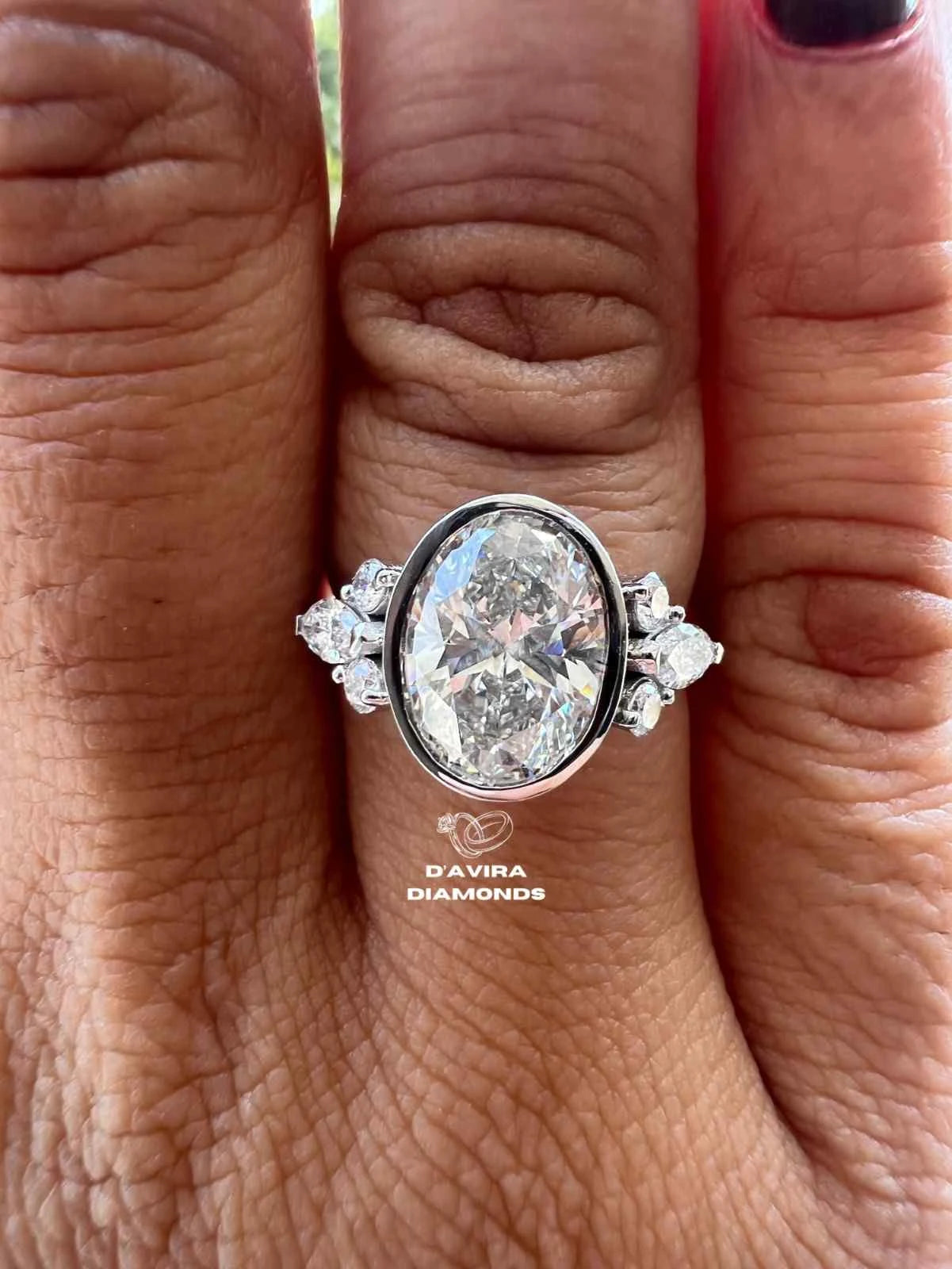 Lab grown oval engagement rings with Bezel Setting Featuring oval Side Stones