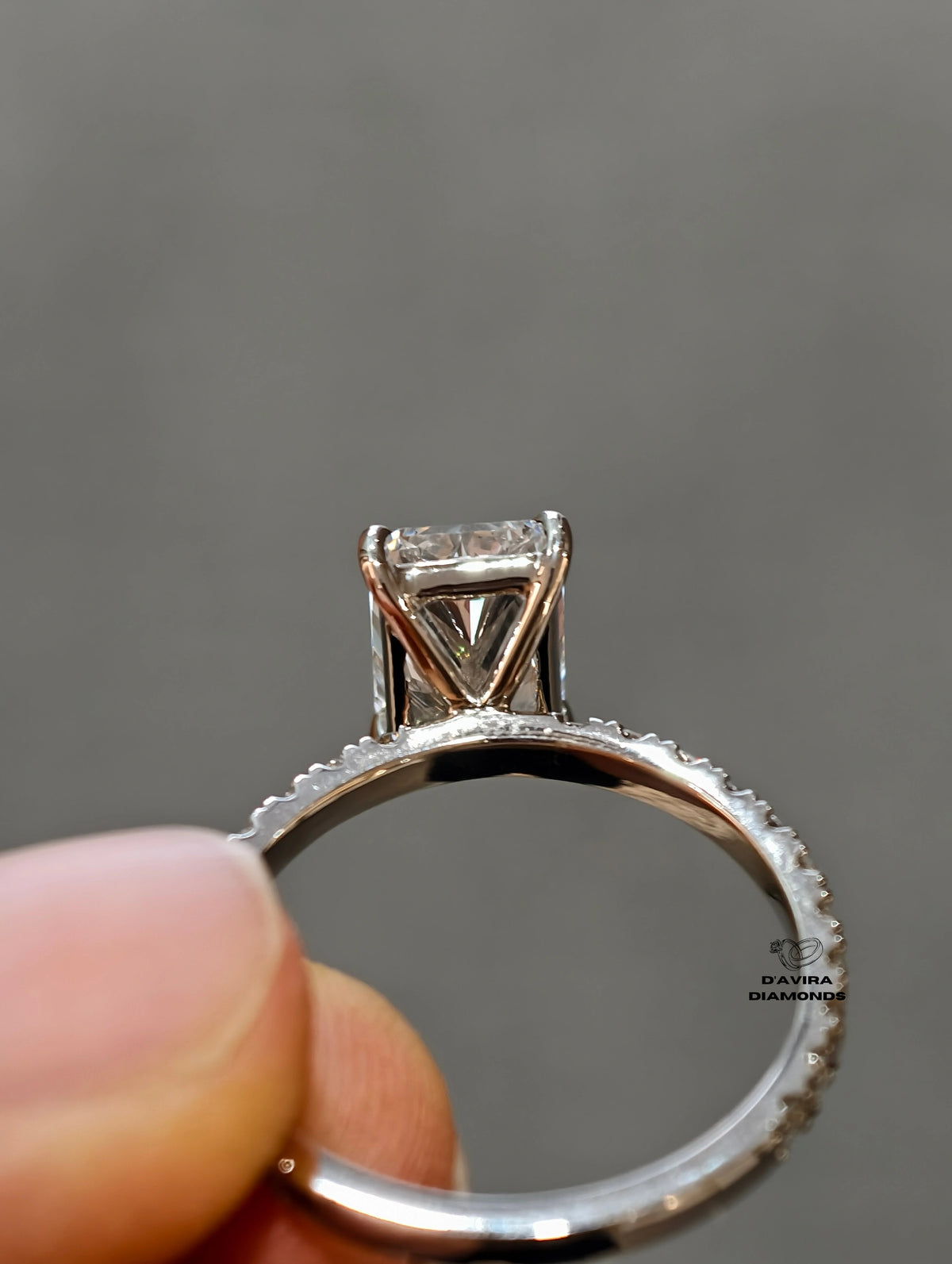 Radiant cut diamond engagement ring with a pave diamond band 