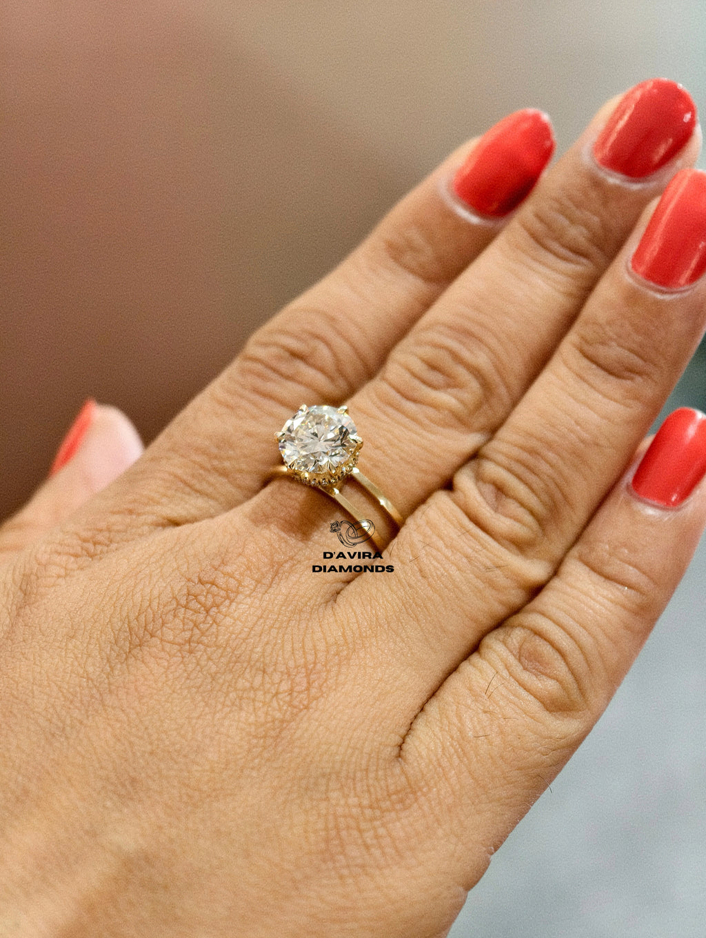 classic yellow gold solitaire ring with a large round-cut diamond 