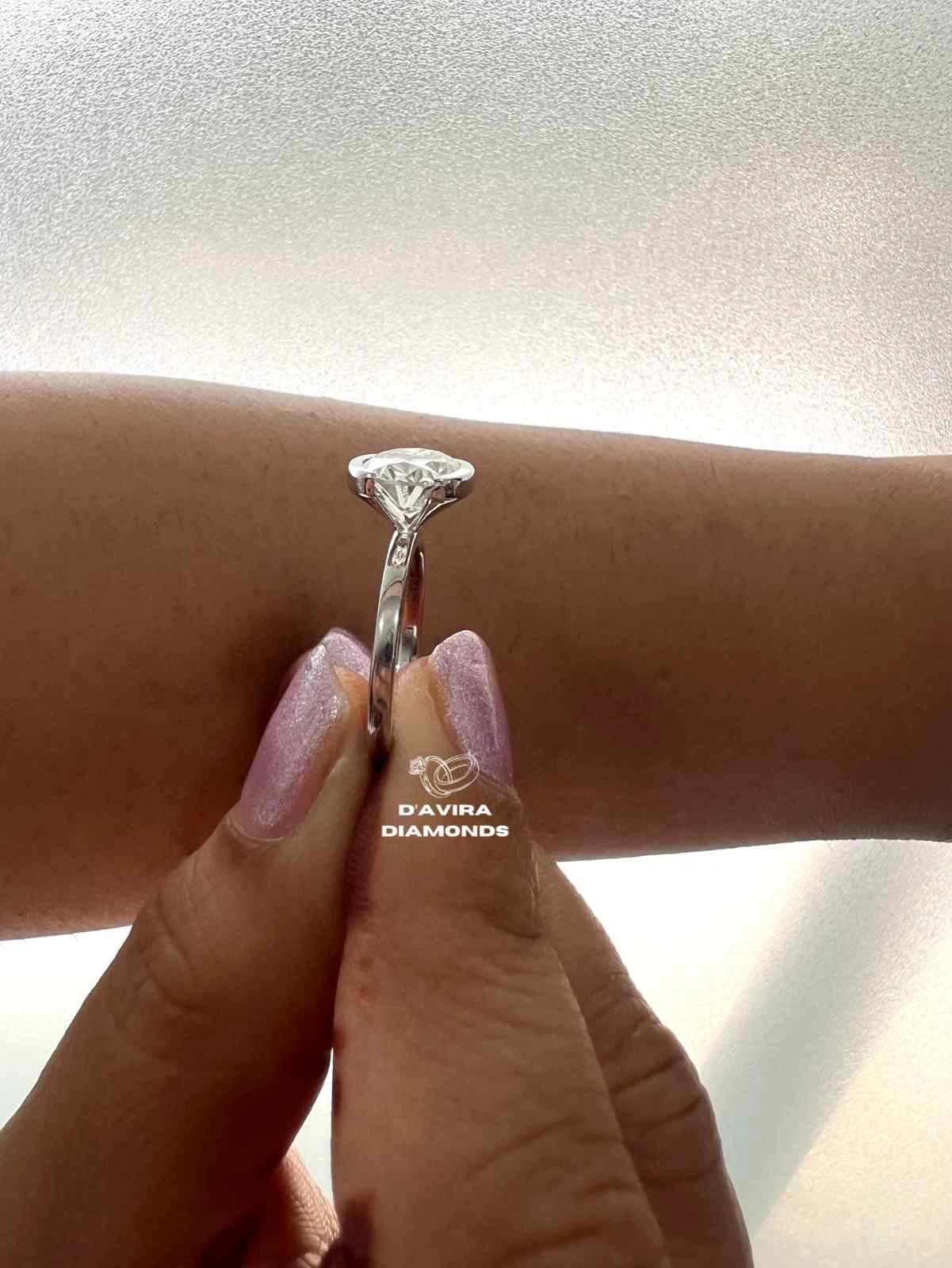 East West Oval Cut Half Bezel Set Diamond Ring