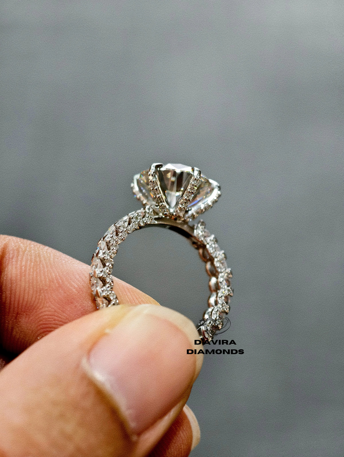 side view of the round cut intricate pave prong diamond ring