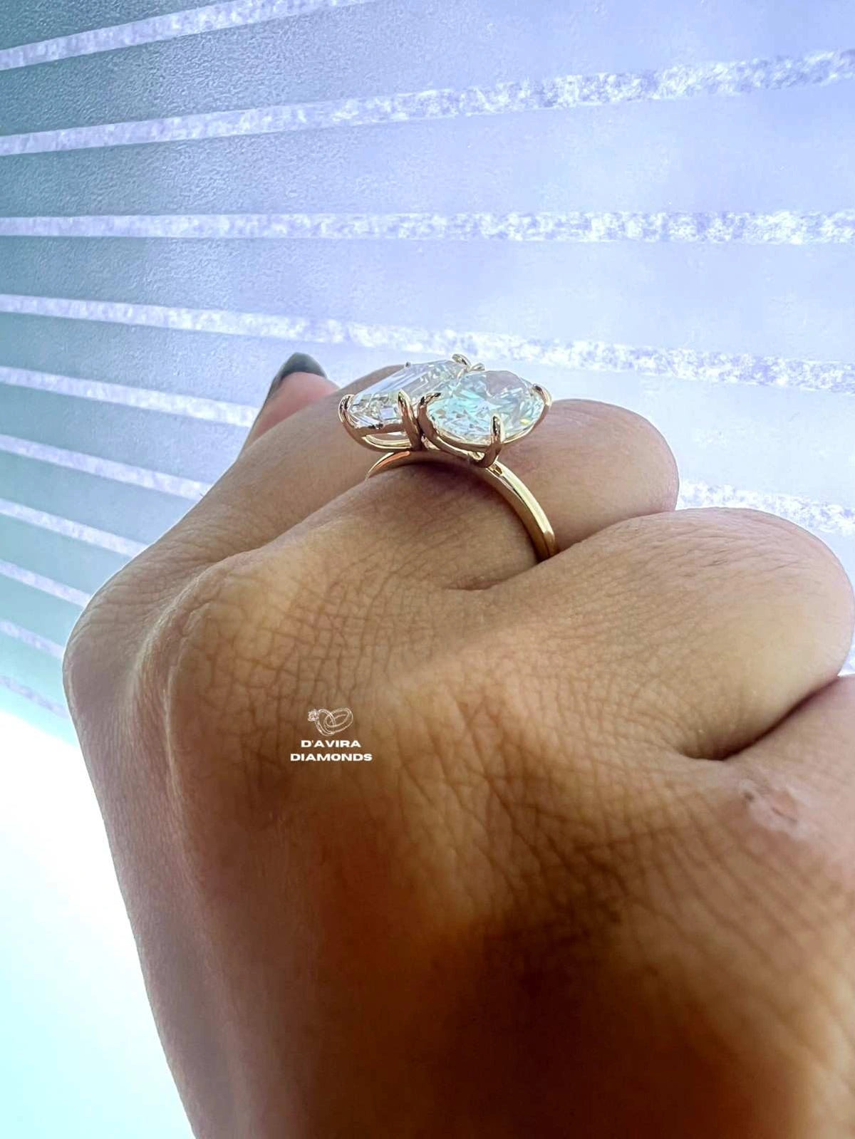 Side view of a yellow gold Toi et Moi two-stone ring