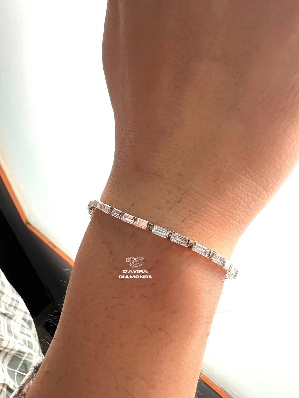 front view Emerald cut lab grown diamond tennis bracelet worn on wrist