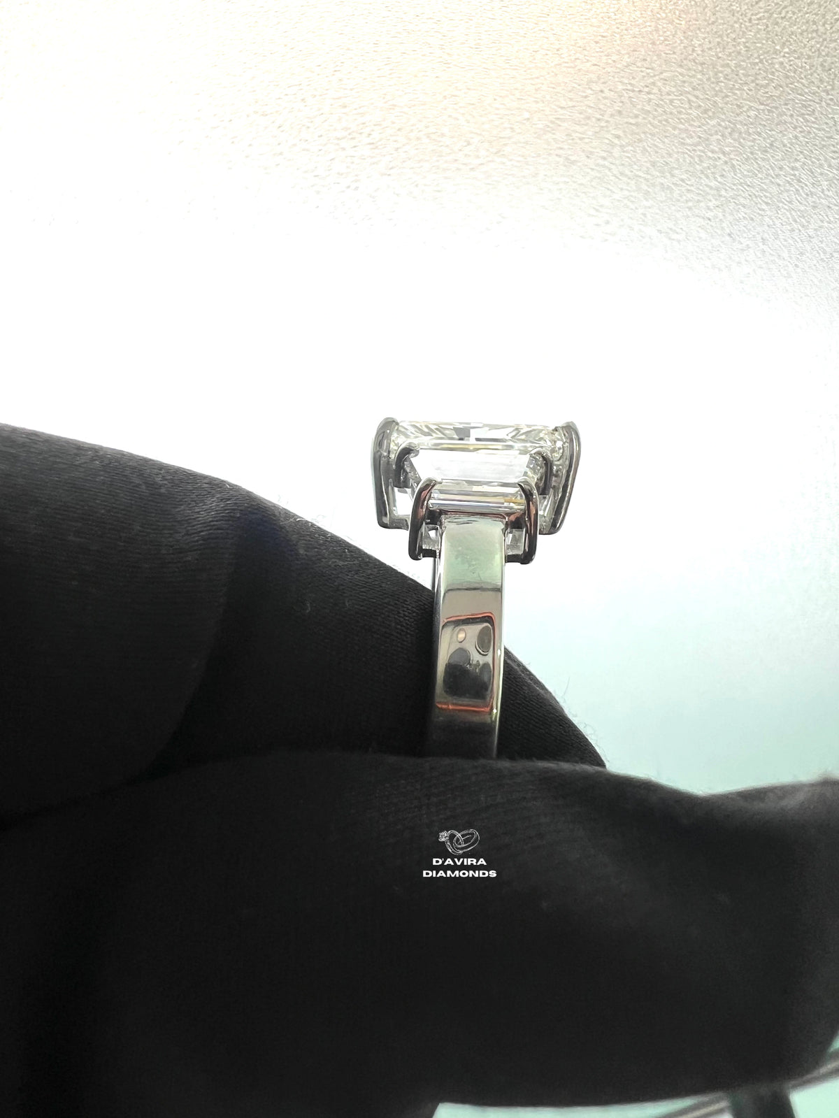 side view of the emerald cut trapezoid side stones ring
