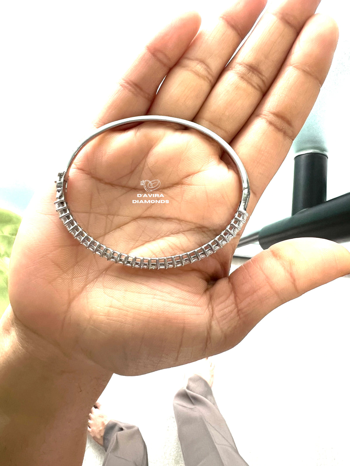 Sustainable lab grown diamond oval tennis bracelet on hand