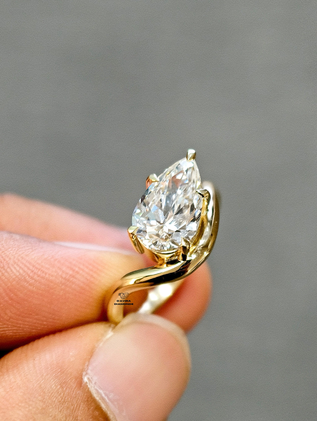 side view of the single pear cut wave shank lab diamond ring