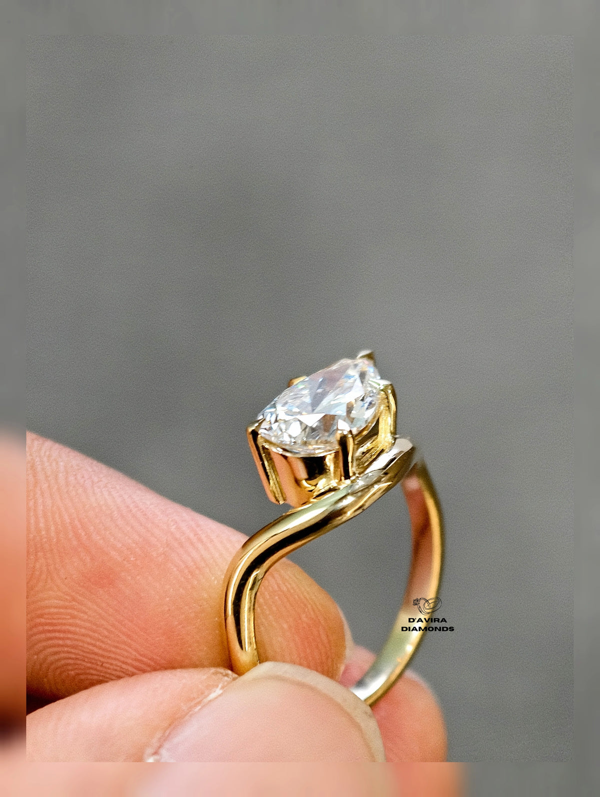 side view of the east west pear cut curved shank lab diamond ring