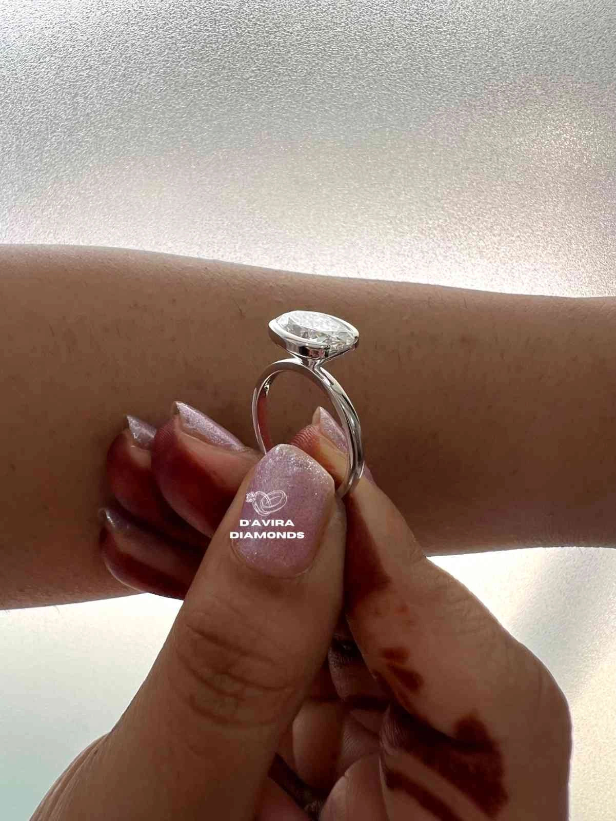 East West Oval Cut Half Bezel Set Diamond Ring