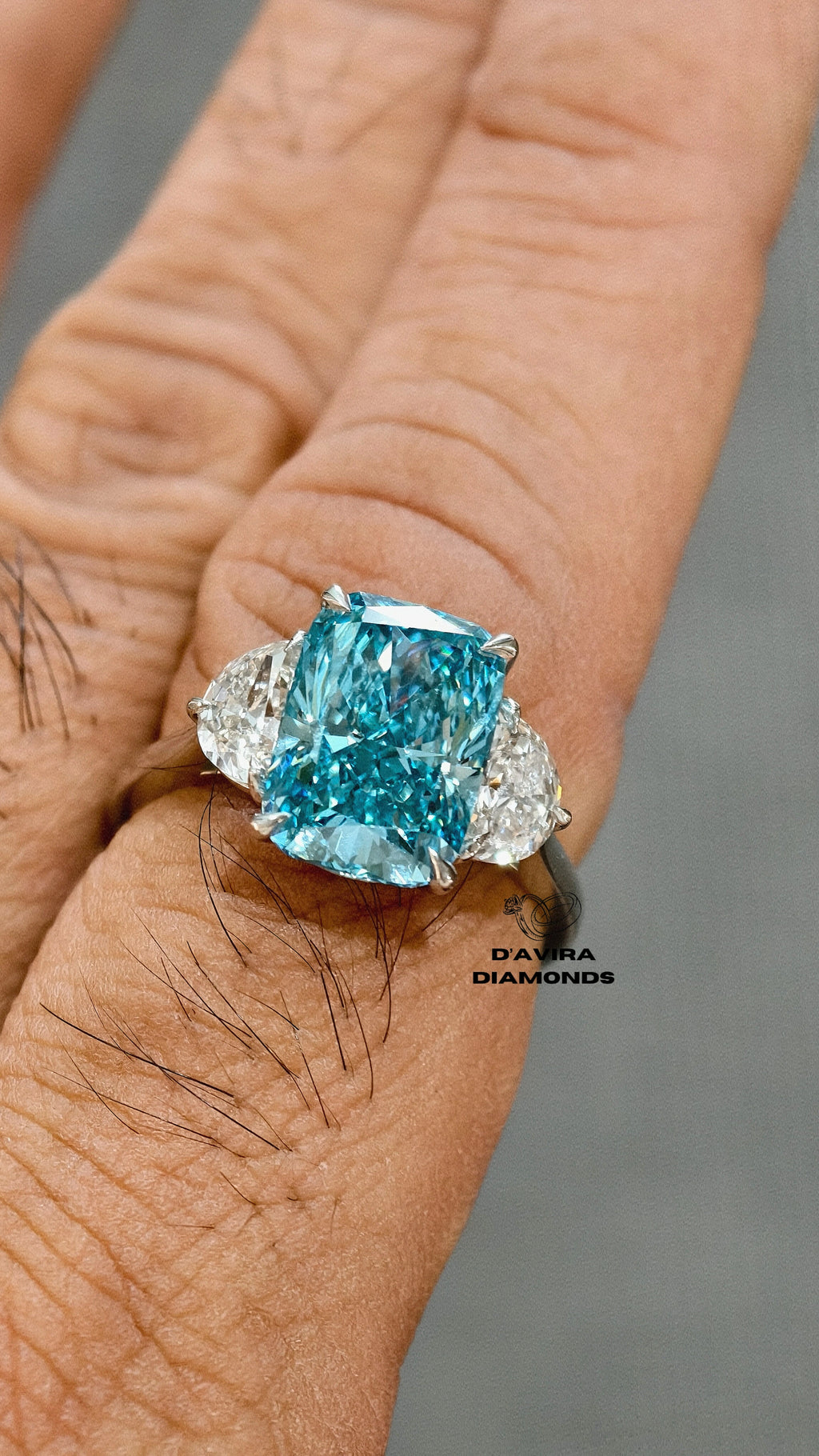 close up front view of the minimalist three stone radiant cut diamond ring 