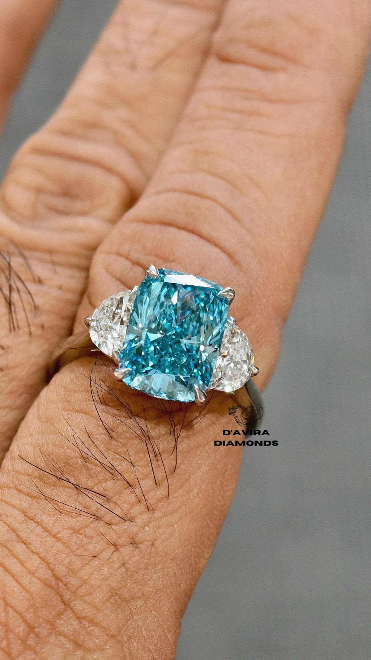 close up front view of the minimalist three stone radiant cut diamond ring 