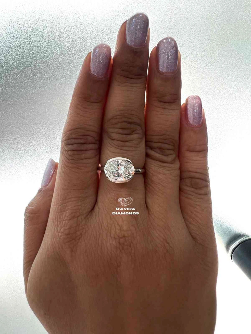 East West Oval Cut Half Bezel Set Diamond Ring