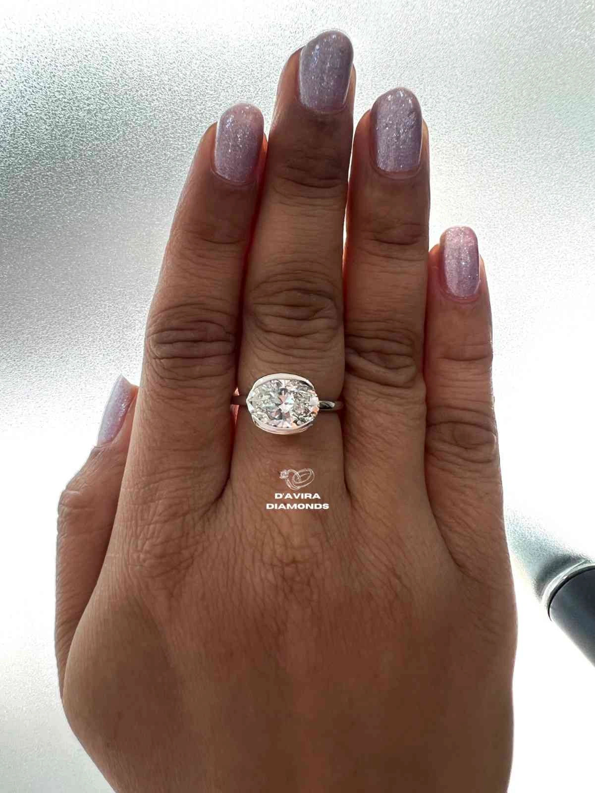 East West Oval Cut Half Bezel Set Diamond Ring