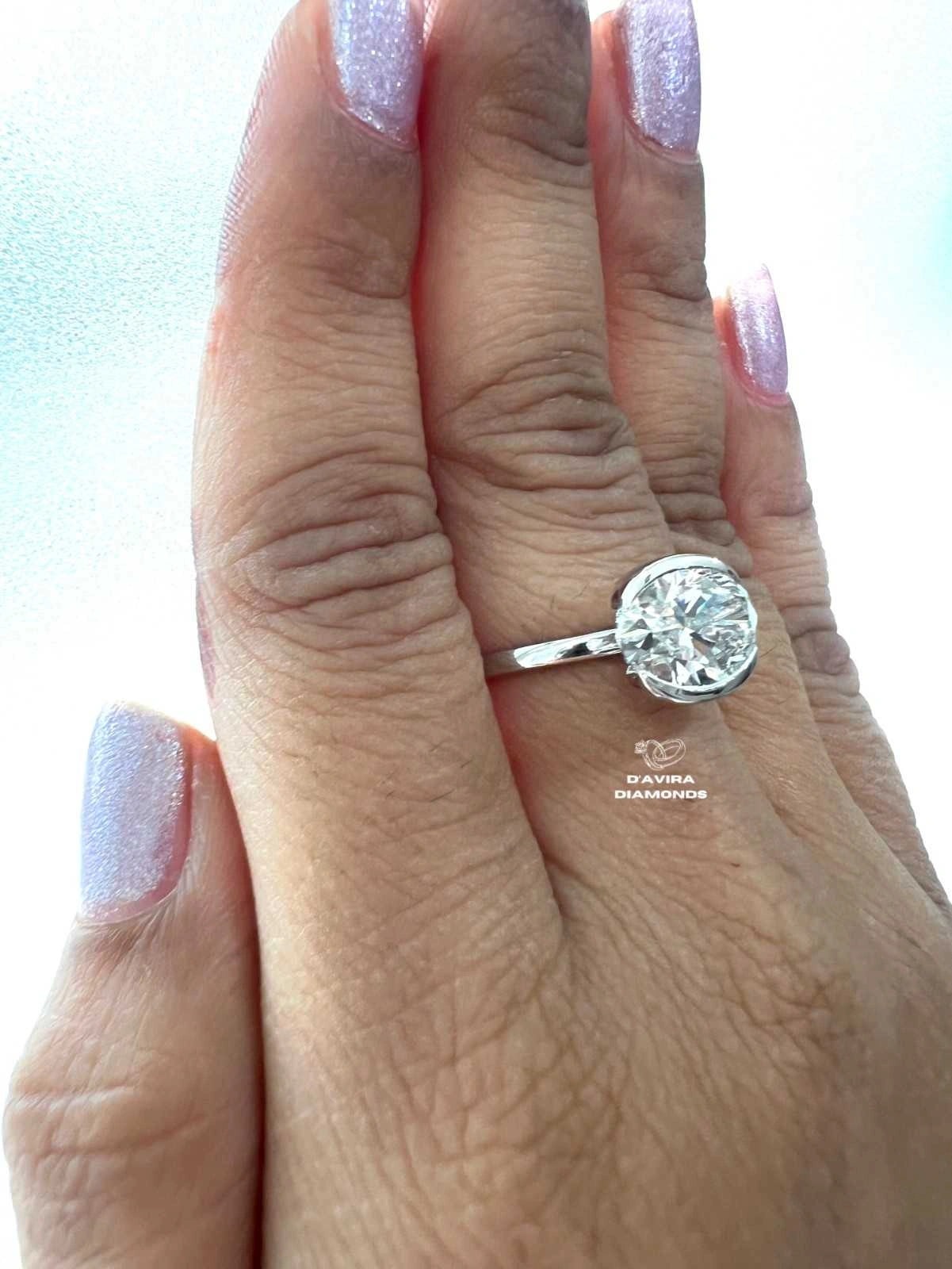 East West Oval Cut Half Bezel Set Diamond Ring
