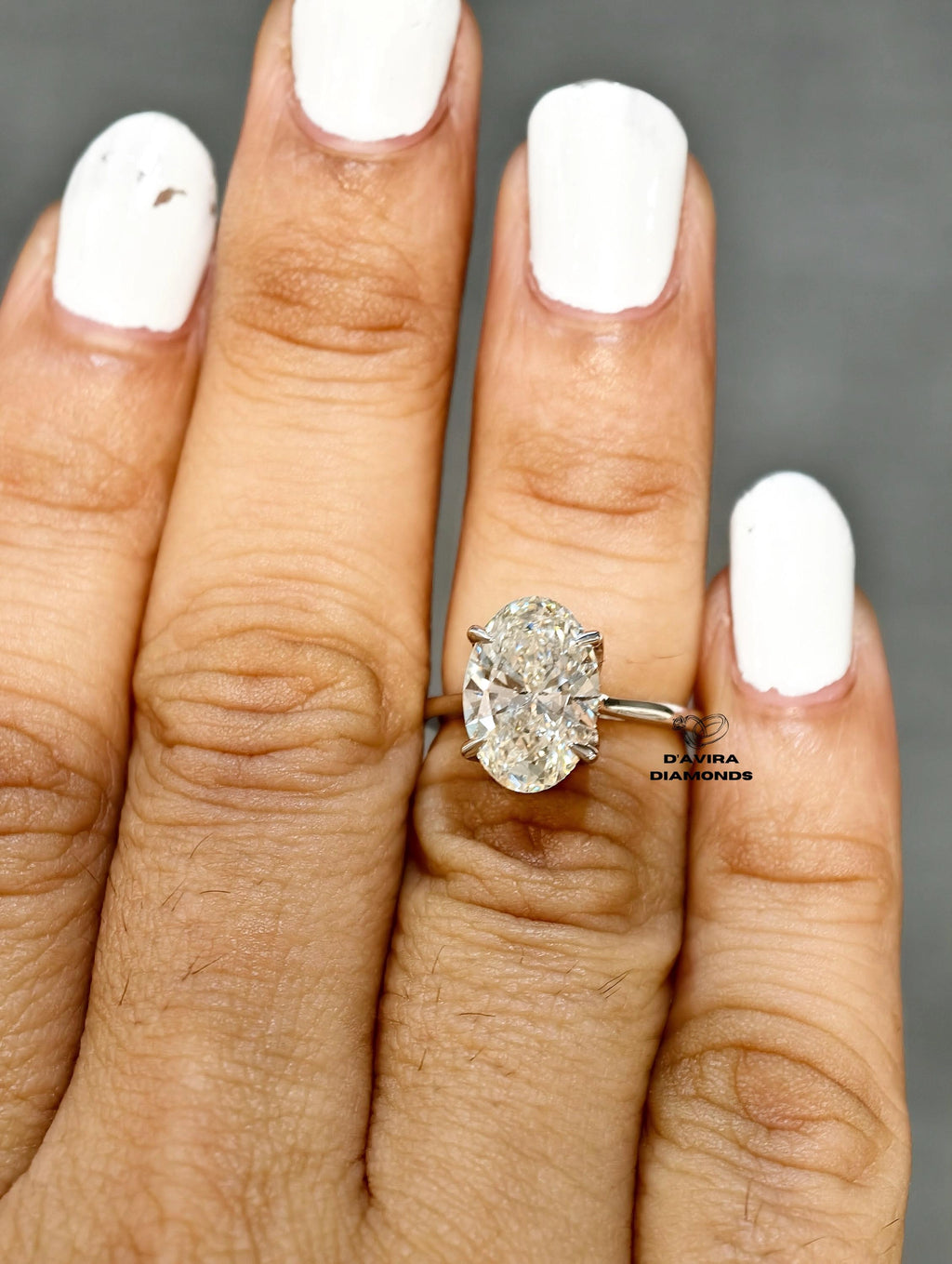 Close up of a oval diamond ring from Diamond minimalist white gold band