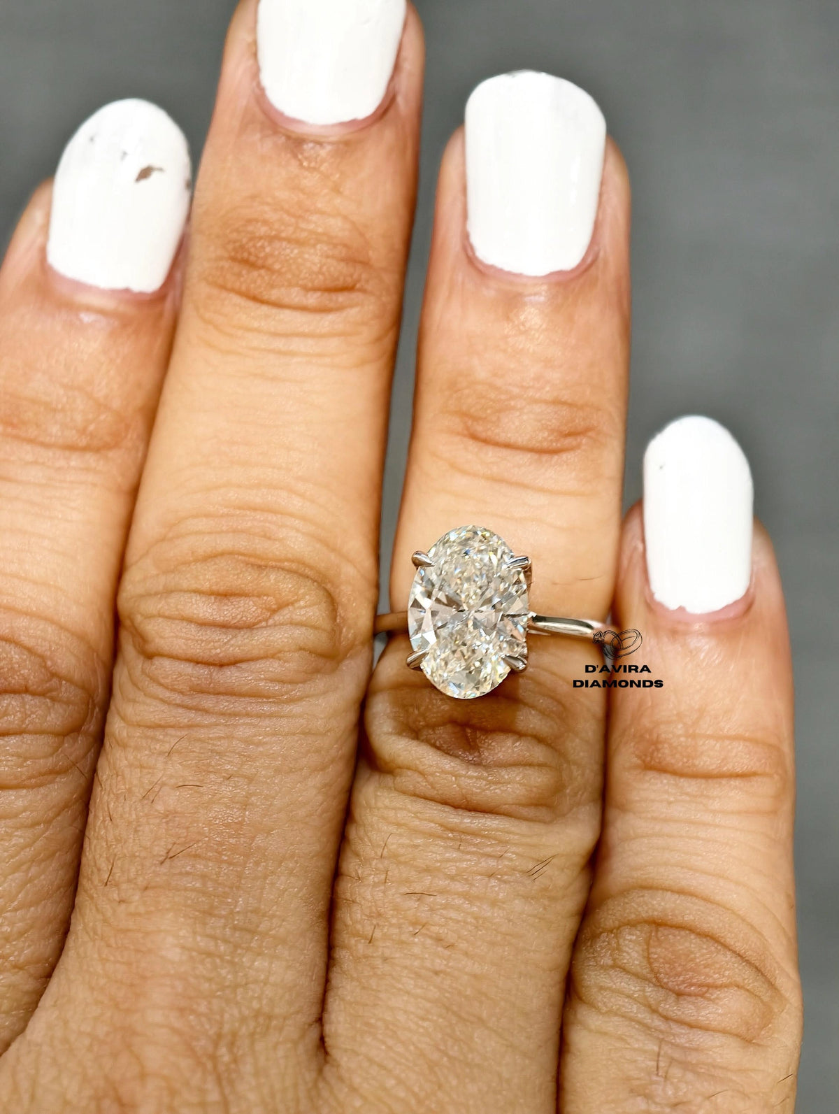 Close up of a oval diamond ring from Diamond minimalist white gold band