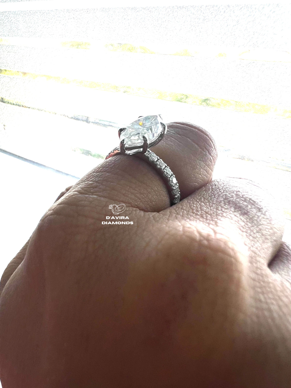 side view of an marquise cut lab grown diamond solitaire set with claw prongs