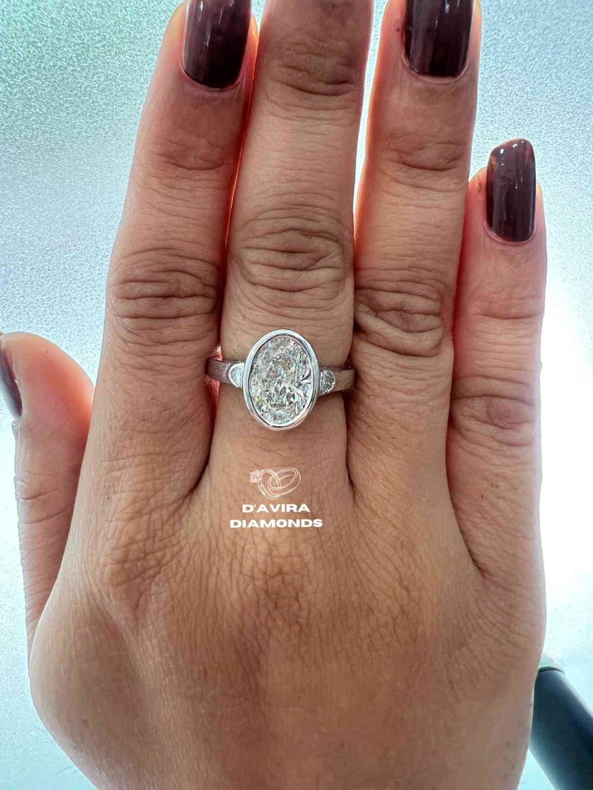 Lab Grown Oval Engagement Ring in Bezel Setting Three Stone style