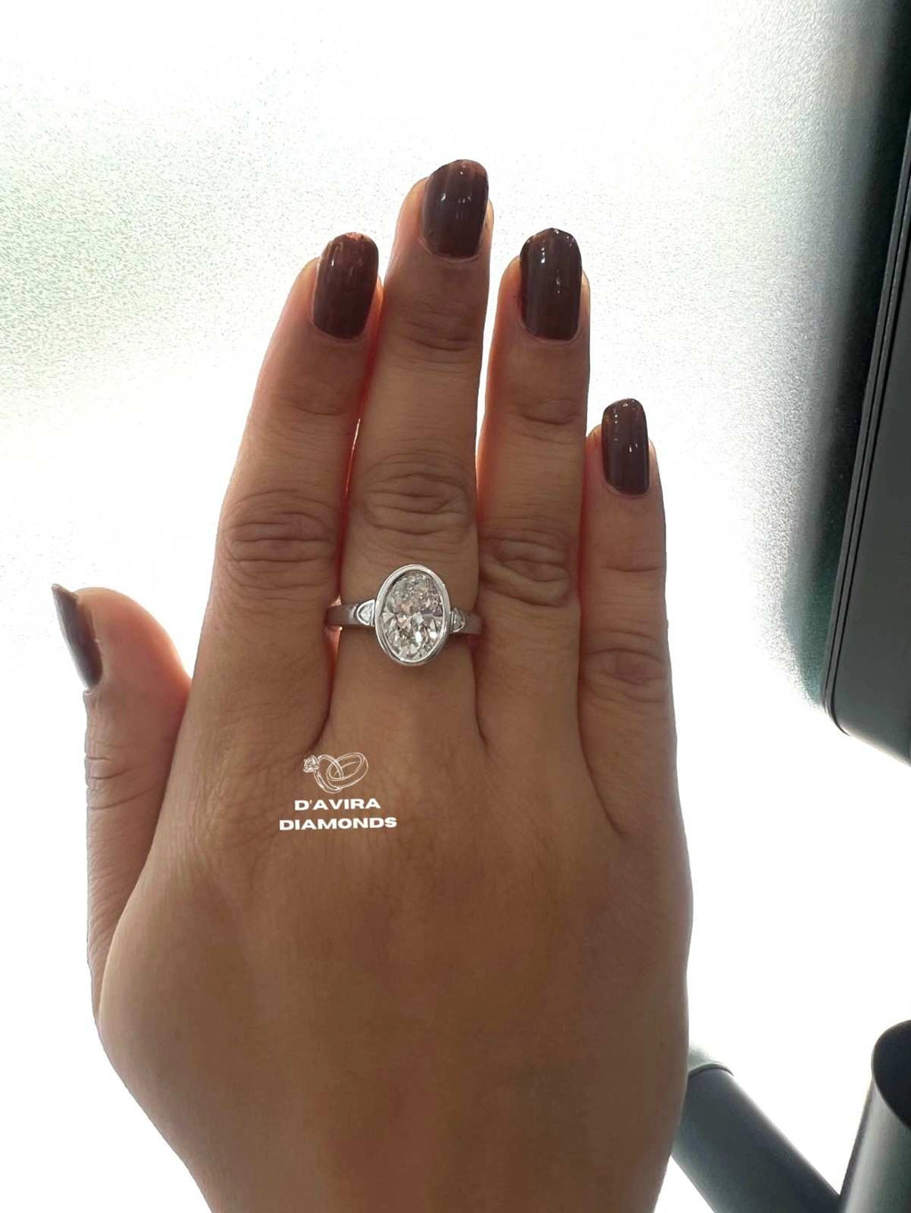 Lab Grown Oval Engagement Ring in Bezel Setting Three Stone style